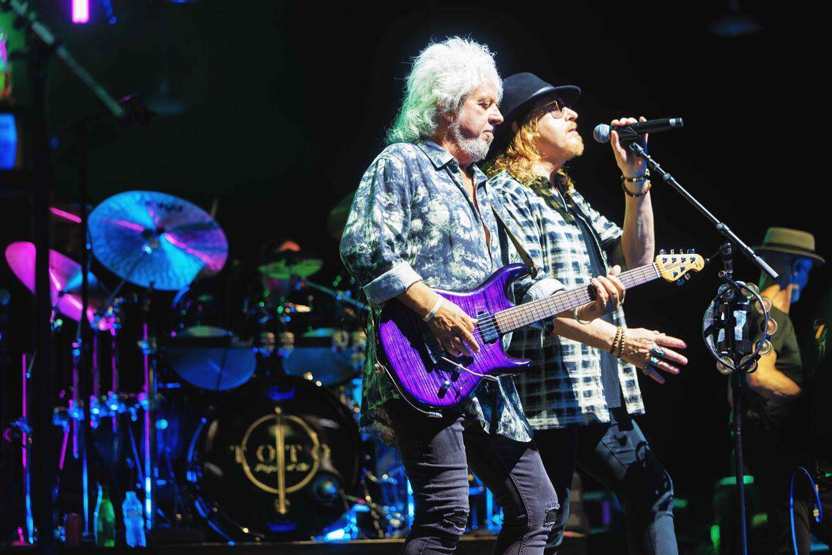 Steve Lukather and Joseph Williams of Toto perform at PNC Music Pavilion on Thursday night.