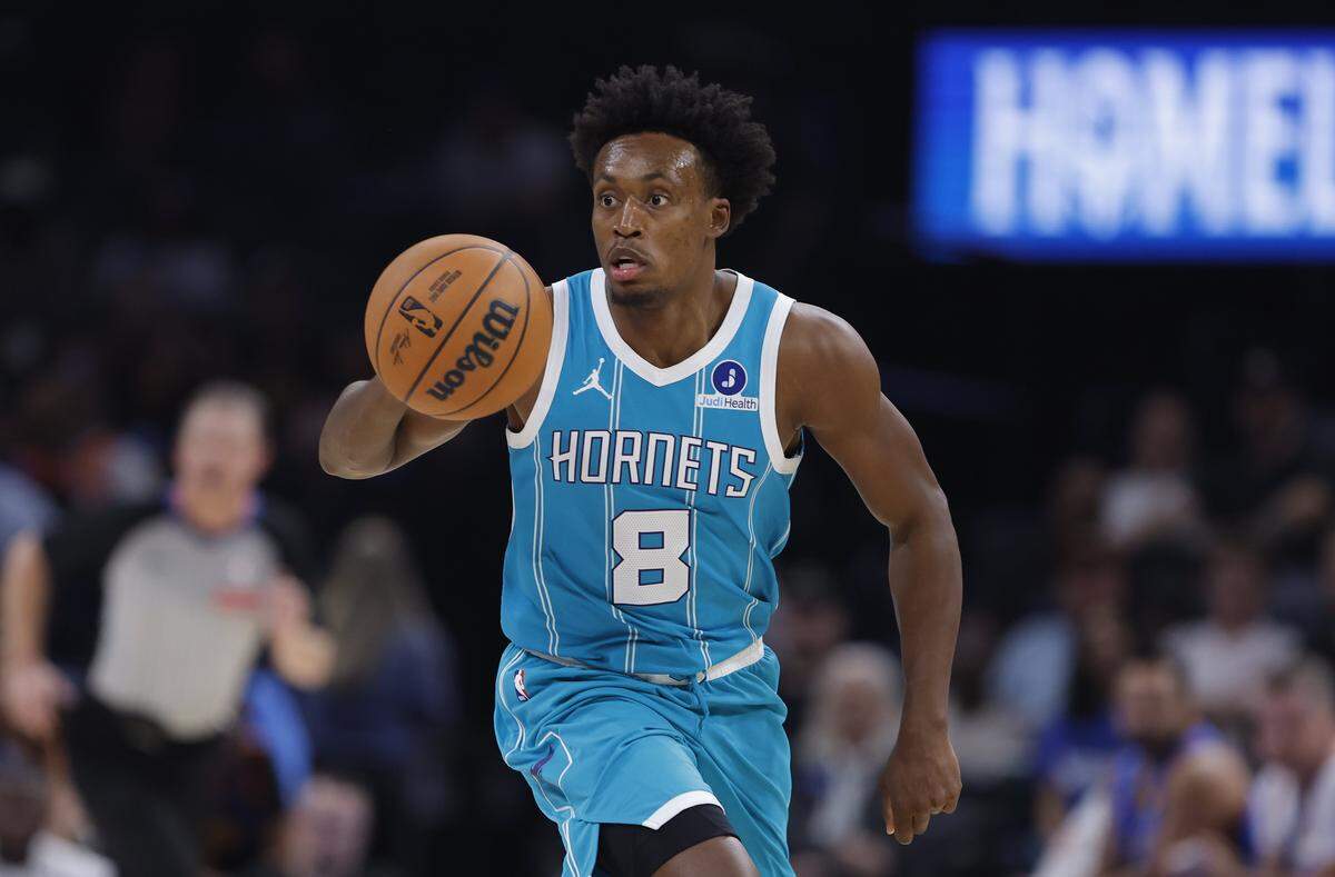 Charlotte Hornets guard Collin Sexton (8) dribbles down the court during the second half of a game between the Charlotte Hornets and the Oklahoma City Thunder at Paycom Center.
