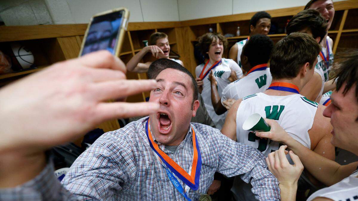 Weddington celebrates in the locker room after the NCHSAA 4A basketball state championship game against Panther Creek at the Smith Center in Chapel Hill, N.C., Saturday, March 12, 2022. Weddington beat Panther Creek 76-58.