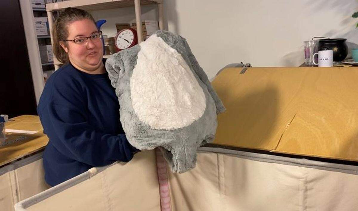 April Woerner, assistant wardrobe supervisor at Charlotte Ballet, pulls a child’s mouse costume from the hamper where they’re kept while waiting for the 2019 season of the Charlotte Ballet to begin.