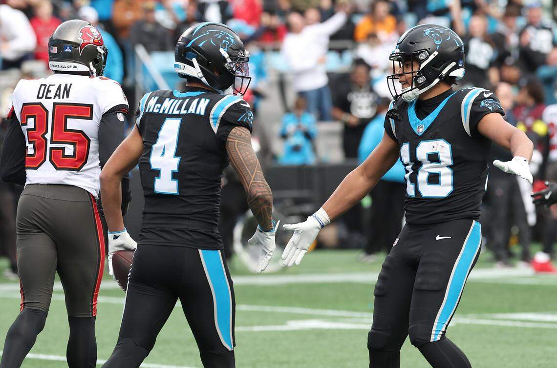 Carolina Panthers wide receiver Tetairoa McMillan, left, is congratulated by wide receiver Jalen Coker after McMillan caught a touchdown pass during action against the Tampa Bay Buccaneers on Sunday, Dec. 21, 2025, at Bank of America Stadium in Charlotte, North Carolina.