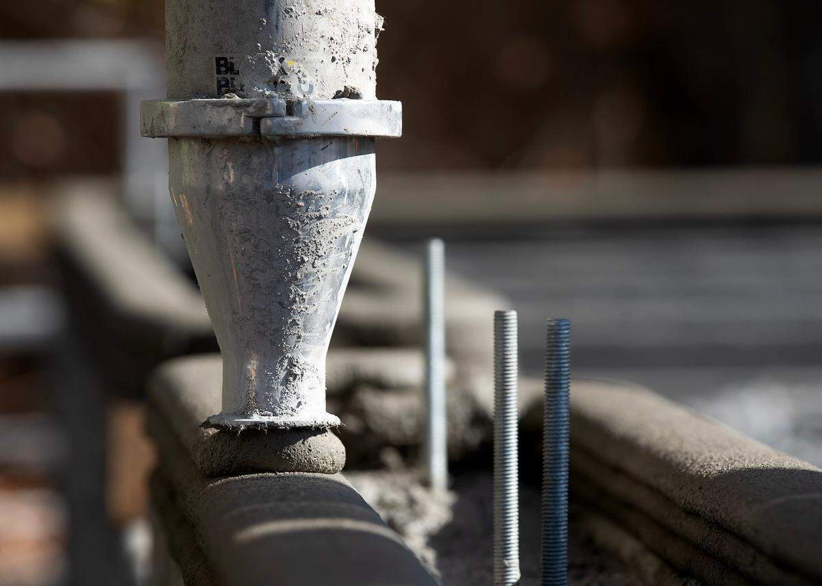 A 3D printer lays down concrete for the walls of a new Habitat for Humanity home in Newport News Wednesday November 9, 2022. The homes are being built for Habitat by Alquist 3D.