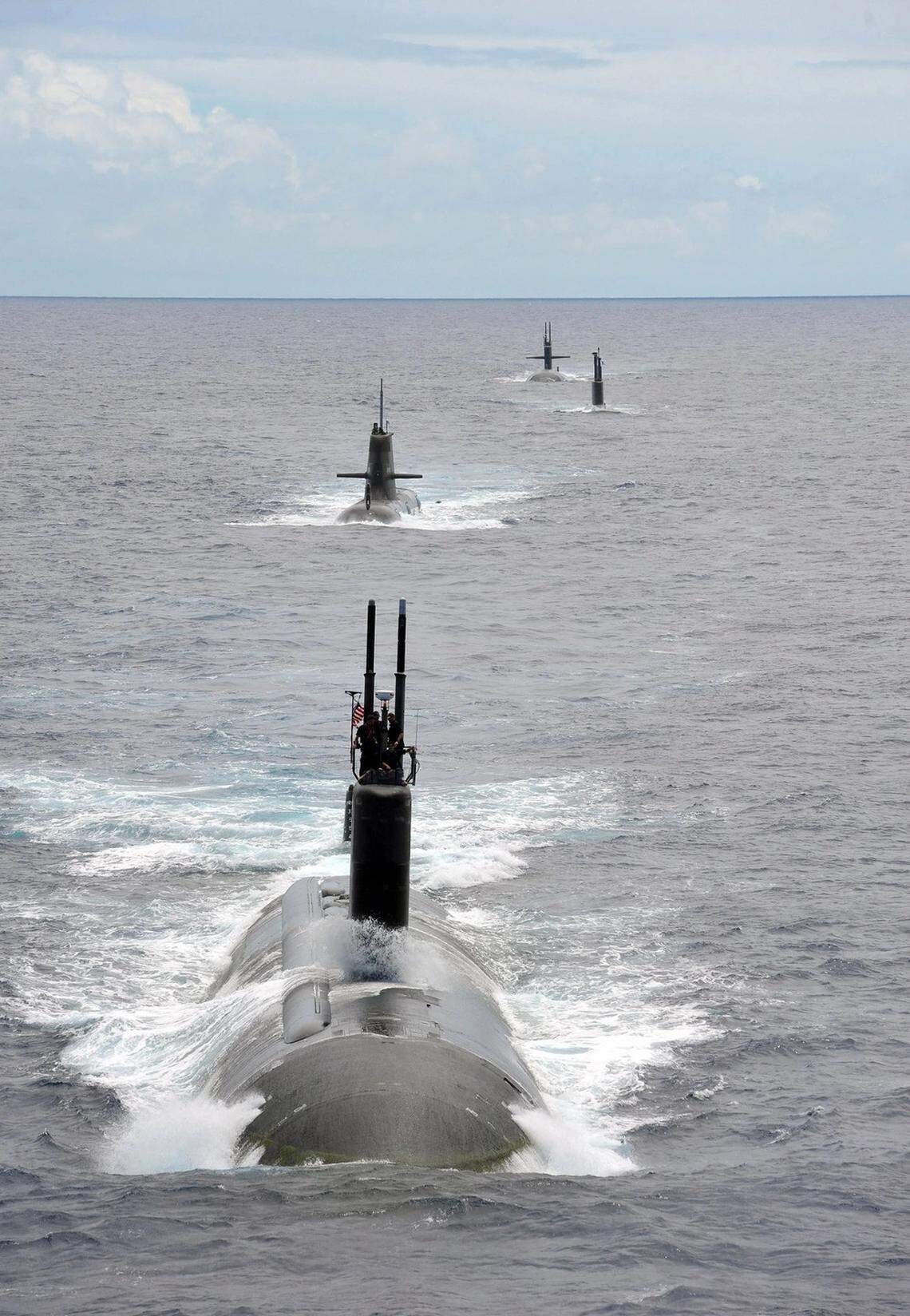 The Los Angeles class fast attack submarine USS Charlotte (SSN 766) steams in a close formation as one of 42 ships and submarines representing 15 international partner nations during Rim of the Pacific (RIMPAC) Exercise 2014.