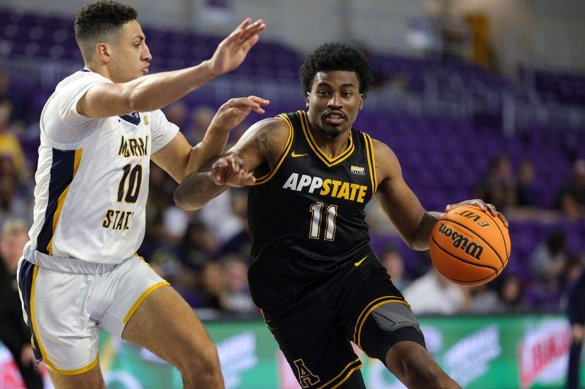 Nov 22, 2023; Fort Myers, FL, USA; Appalachian State Mountaineers forward Donovan Gregory (11) drives to the hoop past Murray State Racers guard Quincy Anderson (10) in the second half during the Fort Myers Tip-Off at Suncoast Credit Union Arena. Mandatory Credit: Nathan Ray Seebeck-USA TODAY Sports