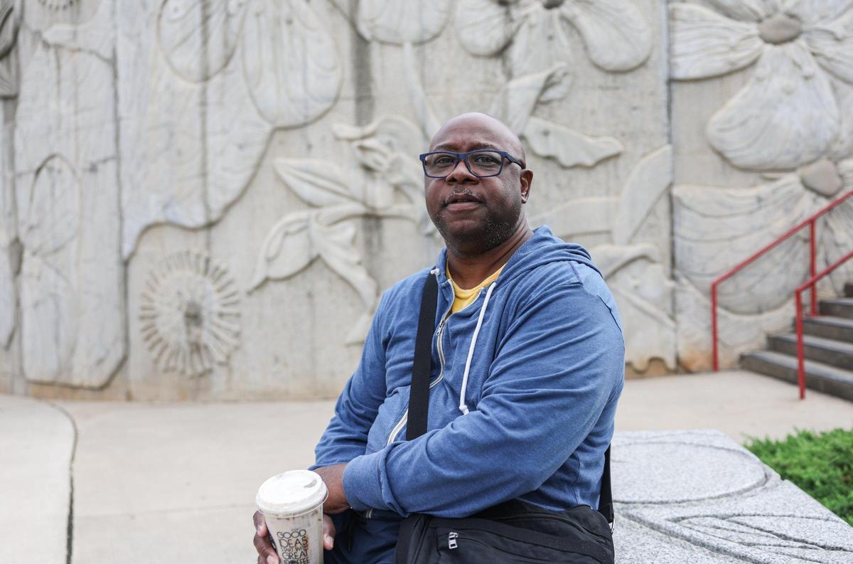 After exiting the light rail at the 36th Street stattion, Garrick Combs waits for another bus after grabbing a snickerdoodle coffee drink at Water Bean in NODA. Because the bus doesn’t go all the places he wants, sometimes he’ll rent a car from Enterprise to travel long distances.