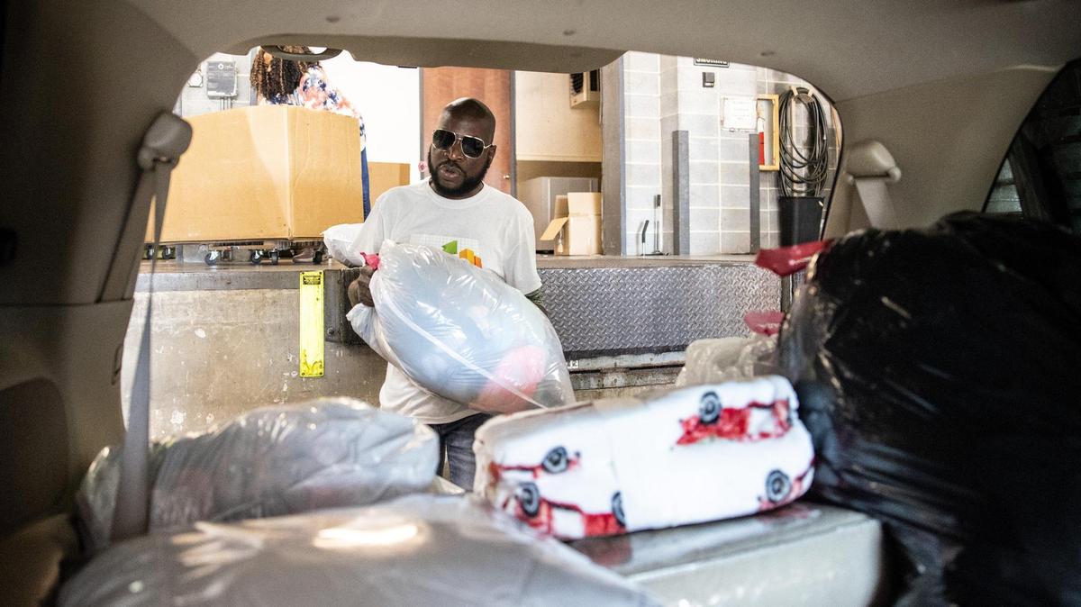 Jermaine Nakia Lee picks up donations for the Poor No More campaign at Belk headquarters in Charlotte, N.C., on Thursday, July 1, 2021.