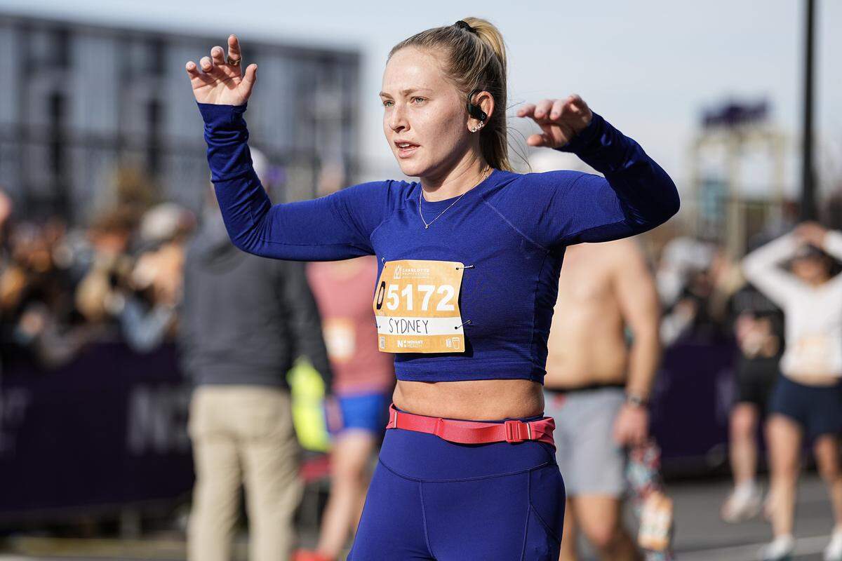 A participant reacts after competing in the Novant Health Charlotte Marathon Saturday, Nov. 15, 2025, in Charlotte, N.C.