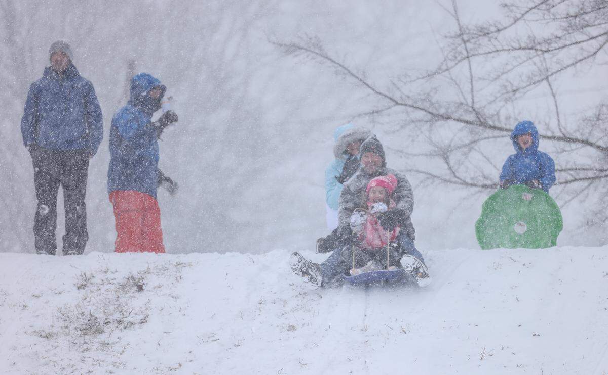 People sled in Cordelia Park in Charlotte, N.C., on Saturday, January 31, 2026.
