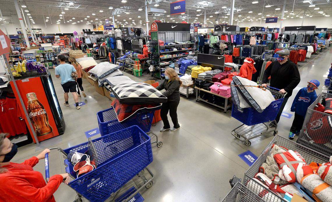 Original: Customers fill and push their shopping carts through the aisles of the Academy Sports + Outdoors store in Matthews, NC on Friday, November 27, 2020. 