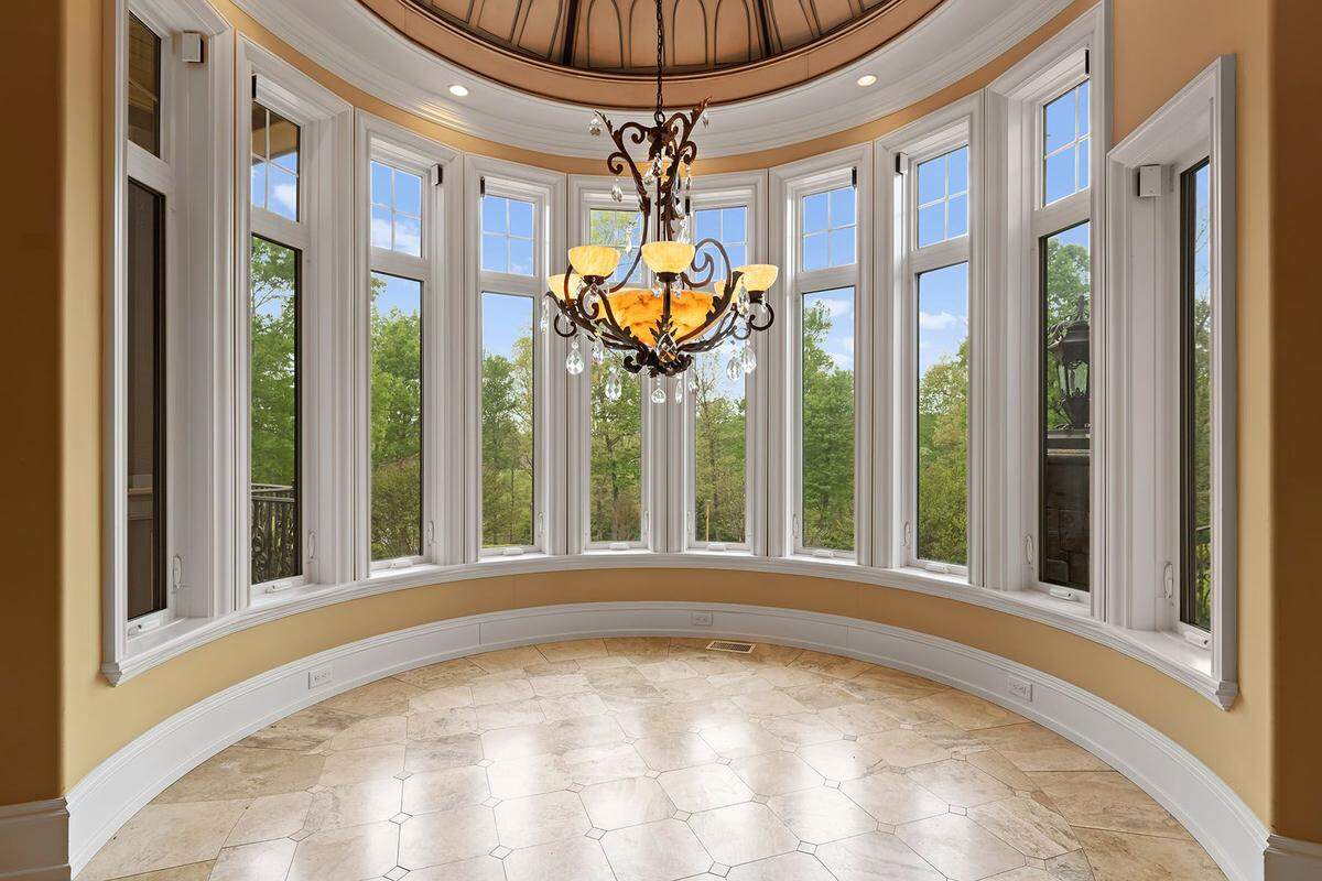 The mansion includes expansive windows looking out across the 12-acre estate.