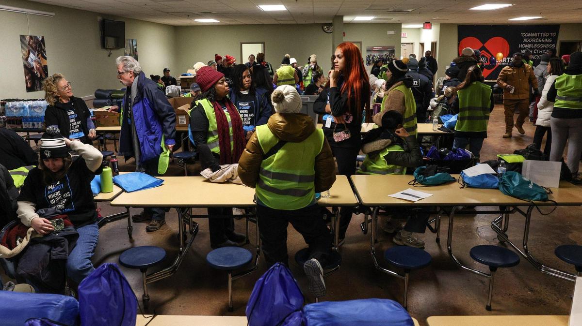 An unidentified unhoused male was found dead Thursday during the Mecklenburg County Point in Time Count, which tracks the unhoused population. Seen here are volunteers that helped with the count.