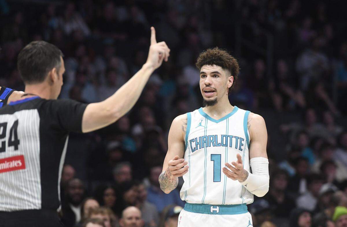 Charlotte Hornets guard LaMelo Ball (1) reacts to a foul call by crew chief Kevin Scott (24) during the first half against the Orlando Magic at the Spectrum Center.