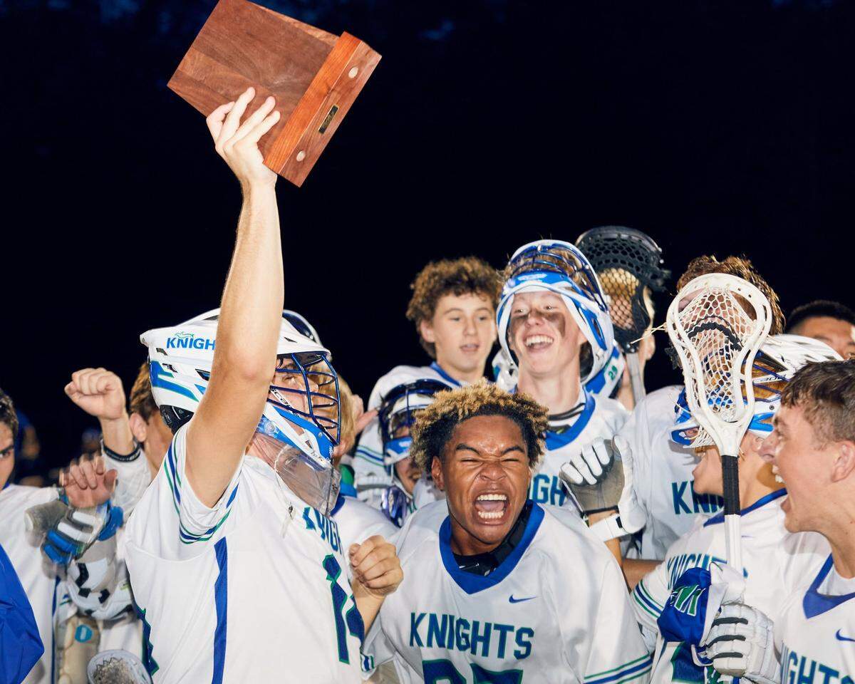 Lake Norman Charter School Knights’ players celebrate their NCHSAA Region Championship over Community School of Davidson 15-8 in Huntersville, NC on May 28, 2025. The Knights head to the State Championship for 1A/2A/3A against the Croatan High School Cougars.