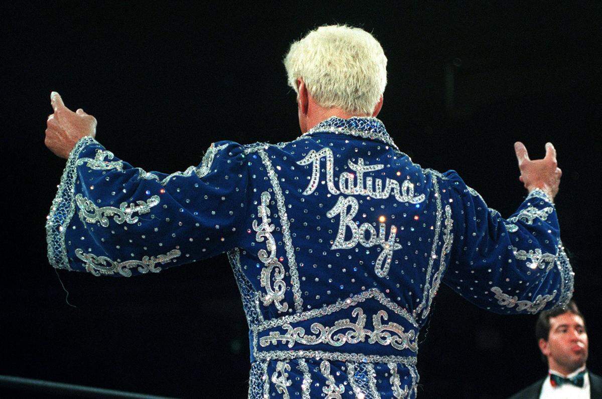 5/3/99 Wrestler Ric Flair acknowledges the cheers of the fans Monday night after entering the ring to face Diamond Dallas Page during Monday Night Nitro at the Charlotte Coliseum.