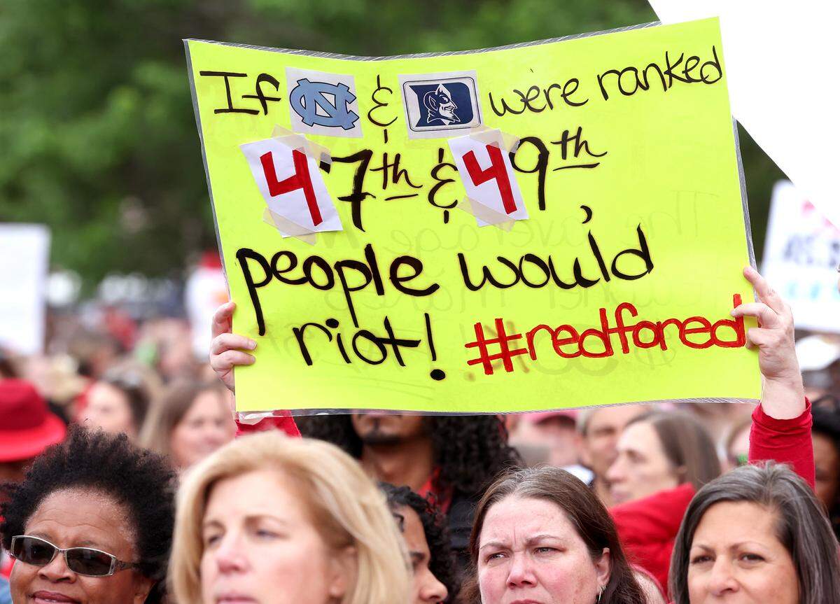 Signs, signs, signs were everywhere as teachers rallied at the Government Complex in Raleigh.