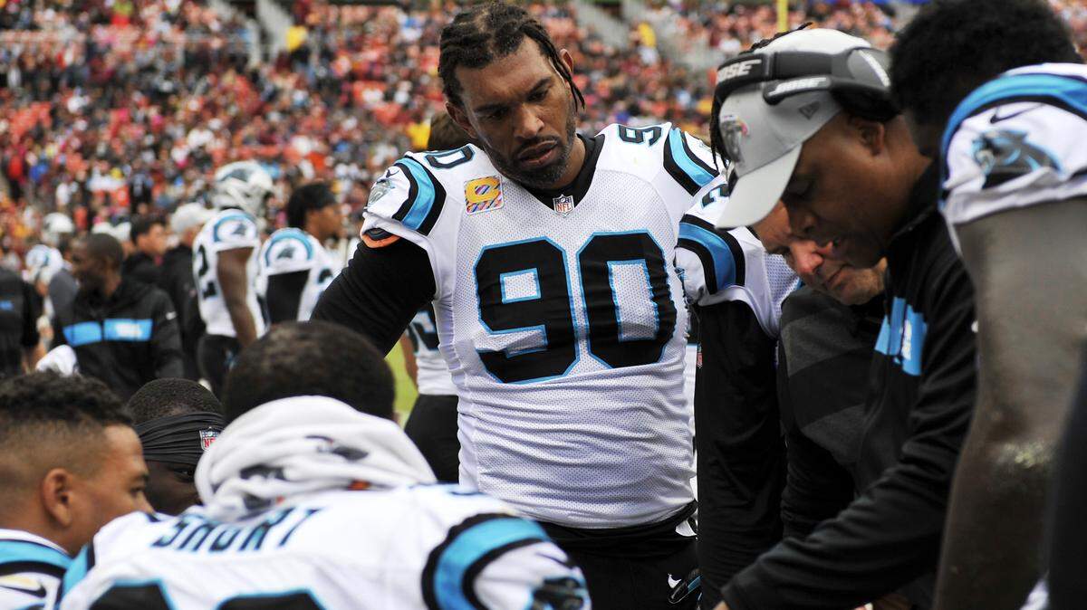 Carolina Panthers defensive end Julius Peppers (center) is a veteran on a pass-rush that has not been consistent this season and must find better ways to disrupt quarterbacks.