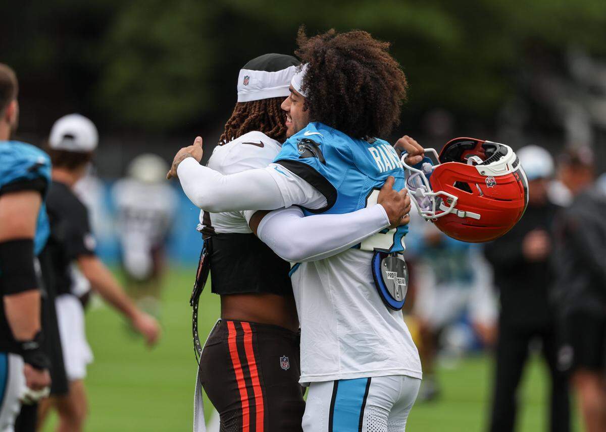 Panthers safety Lathan Ransom, right, hugs Browns safety Ronnie Hickman before joint practice at training camp in Charlotte, NC on Wednesday, Aug. 6, 2025.