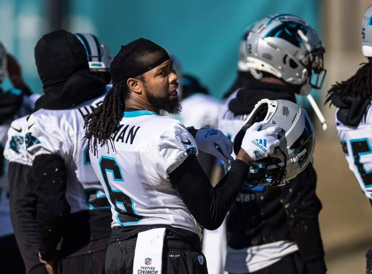 Carolina Panthers cornerback Josh Norman puts his helmet on at practice in Charlotte, N.C., on Wednesday, December 28, 2022.