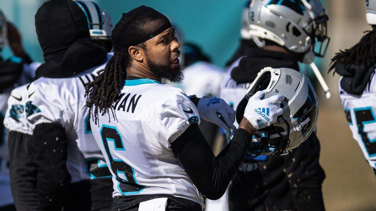 Carolina Panthers cornerback Josh Norman puts his helmet on at practice in Charlotte, N.C., on Wednesday, December 28, 2022.