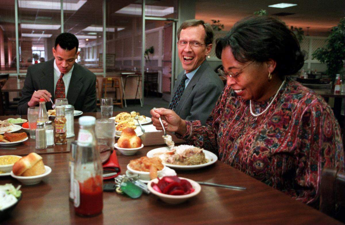 Joe Martin, center, jokes with Cylvia Haddar during lunch at McDonald's Cafeteria with Bobby Singleton, left, in March 1997.