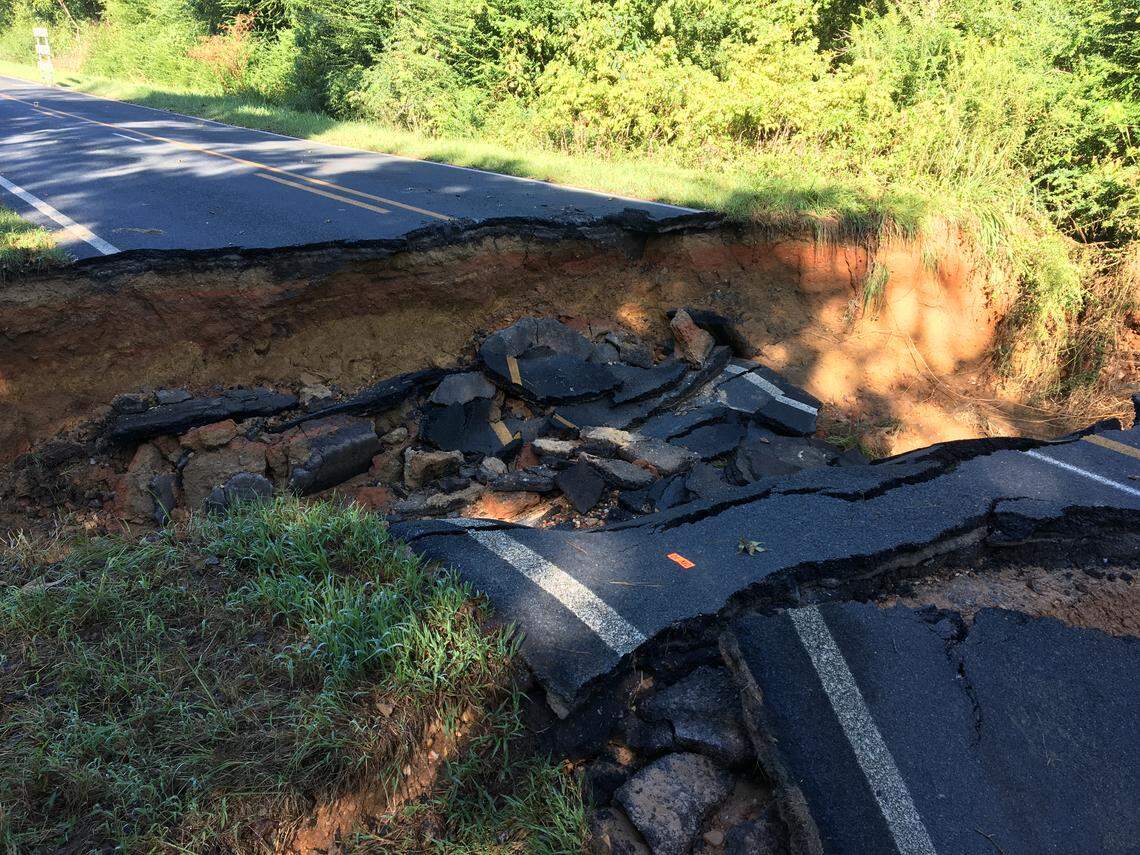 This section of Mayesville Road in southern Anson County, N.C. collapsed after water from an overflowing creek washed away dirt under the roadway.