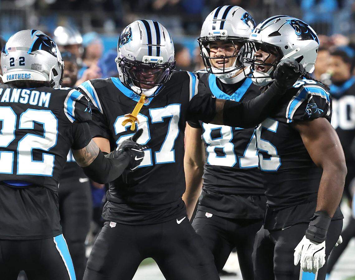 Carolina Panthers safety Isaiah Simmons, center, celebrates his block of a Los Angeles Rams punt with his teammates during action at Bank of America Stadium on Saturday, January 10, 2026. The Rams defeated the Panthers 34-31.