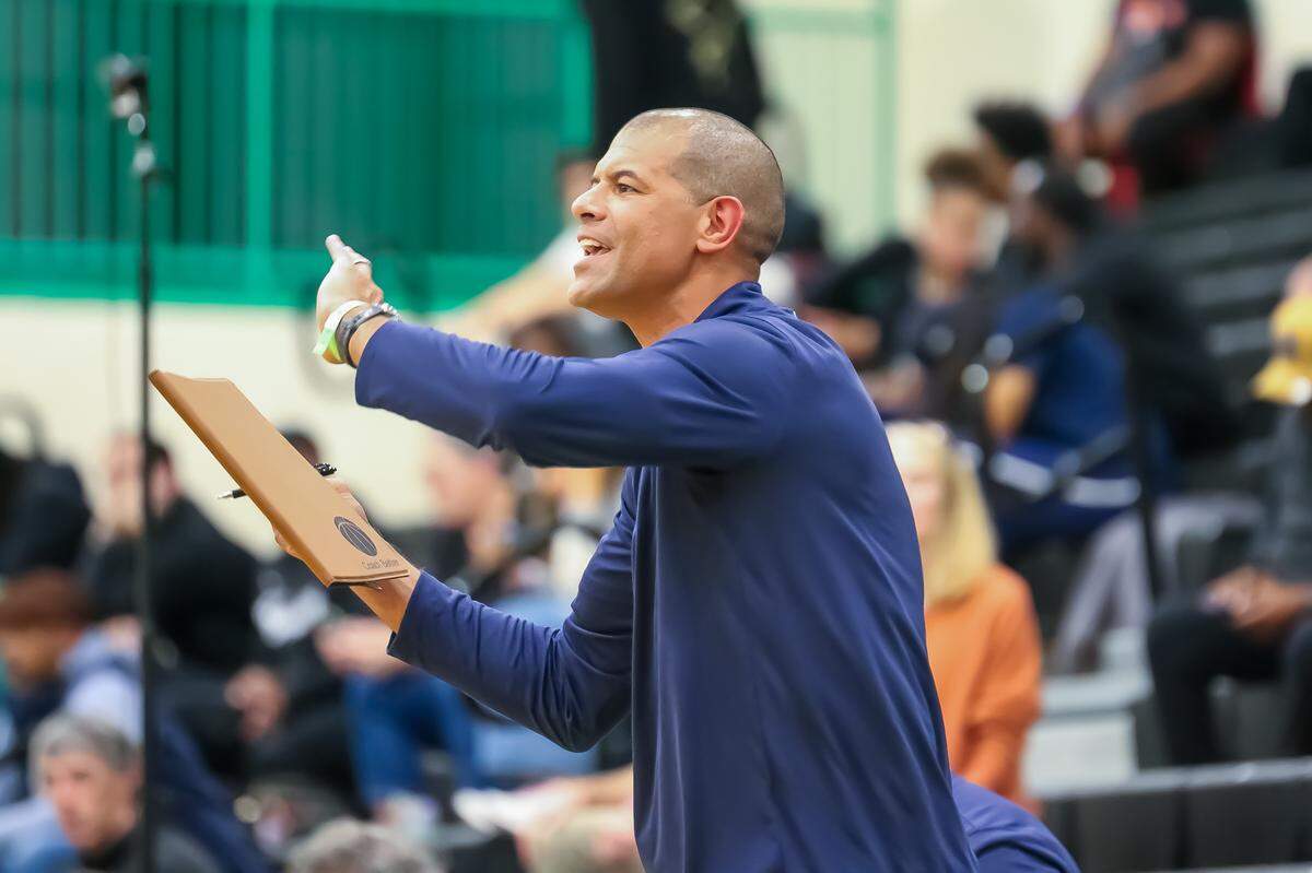Providence Day assistant coach Shane Battier shouts instructions to the team in a November game.