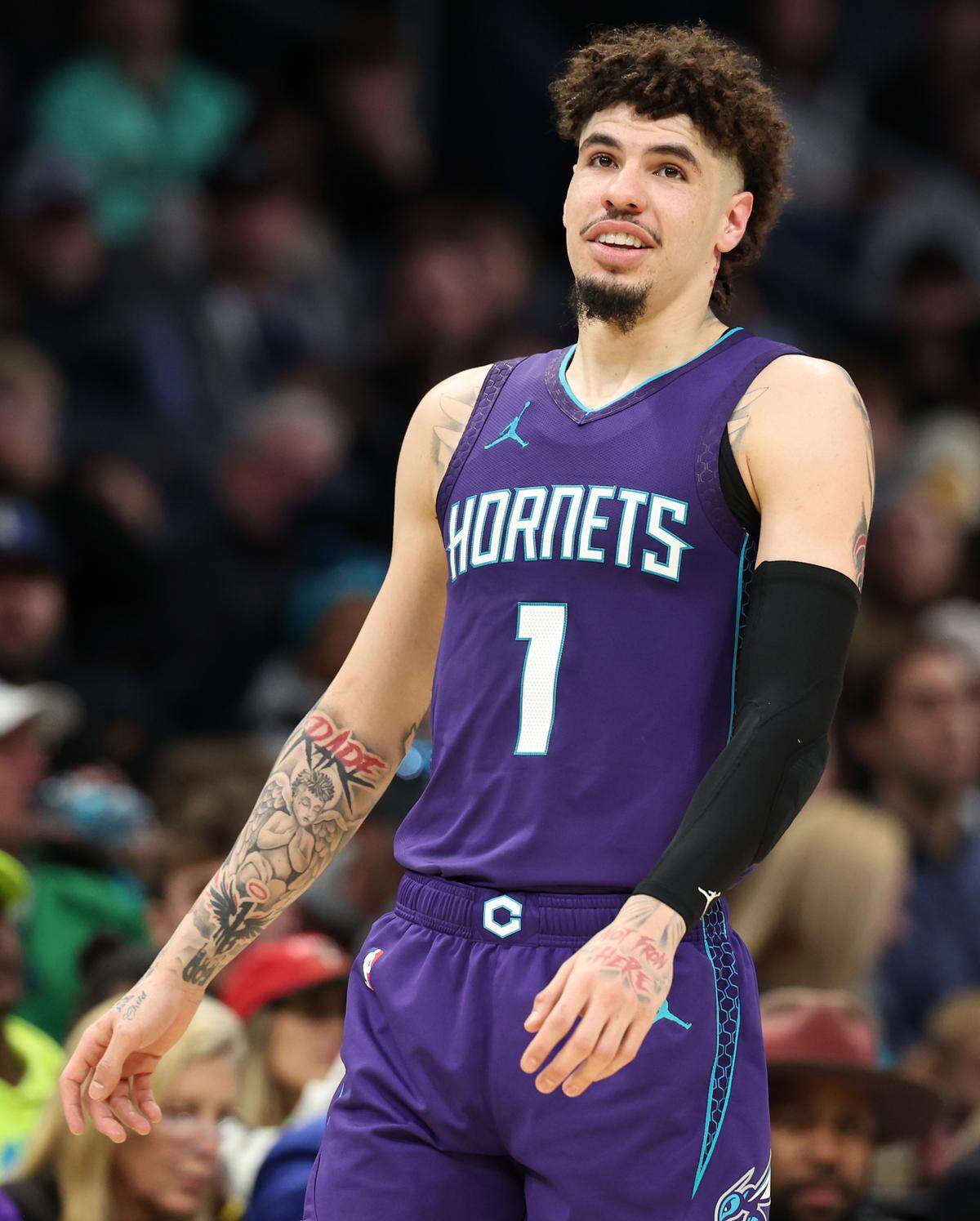Charlotte Hornets guard LaMelo Ball smiles Monday. Ball had 20 of his 23 points in the first half but helped the team in the second half with his defense. “As long as he continues to want to play defense, he’s going to be good at it,” teammate Miles Bridges said.