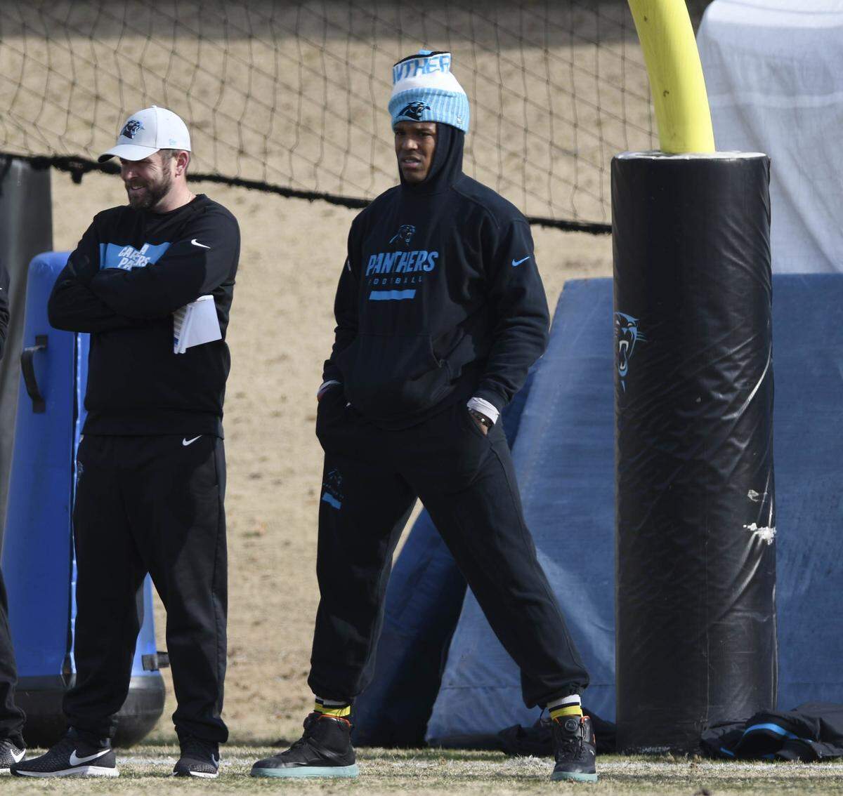 Carolina Panthers quarterback Cam Newton (1) looks on as he stands beside quarterbacks coach Scott Turner on the sideline during practice on Wednesday, December 19, 2018. The Carolina Panthers announced today that Newton will sit for the remaining two games of the season.