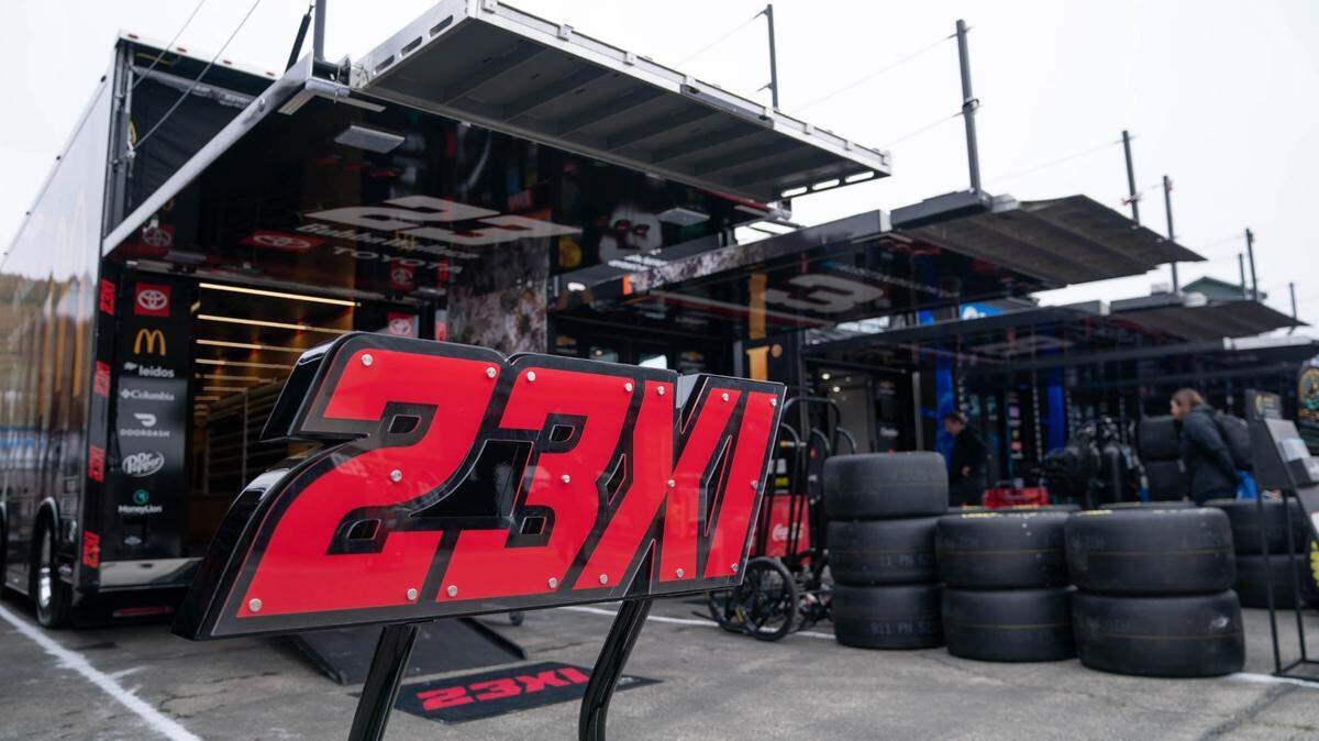 The 23XI team logo is on display in front of the trailer before the start of a race at Sonoma Raceway. Stan Szeto-USA TODAY Sports