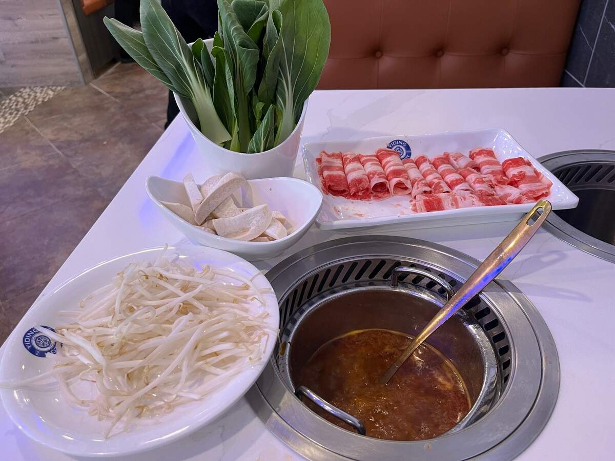 Yiding Hot Pot’s mildly spicy Yiding Mala broth, with bean sprouts, mushrooms, bok choi and beef. 