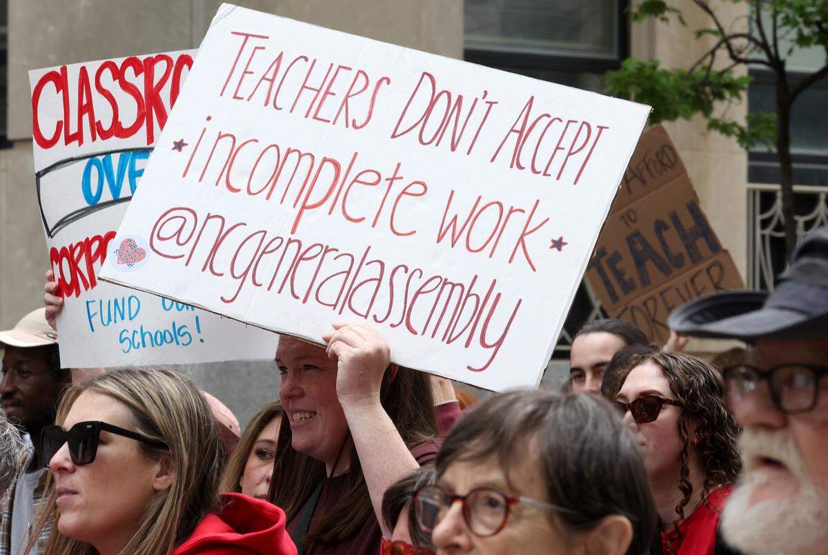 Signs, signs, signs were everywhere as teachers rallied at the Government Complex in Raleigh.