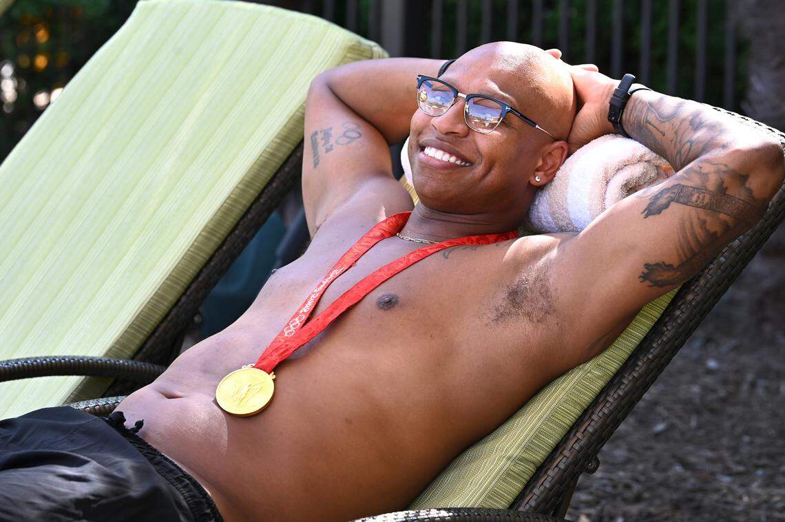 Former Olympic gold medalist swimmer Cullen Jones relaxes poolside at the Life Time outdoor pool. Of the upcoming Olympics in Paris and the inevitable controversies, Jones said: There’s always something at the Olympics. In Beijing, it was pollution. In London, traffic. In Brazil, the Zika virus. Most recently, COVID. ... So now I’m hearing both pollution and traffic for Paris. The host country tends to do a really good at working on these things.”