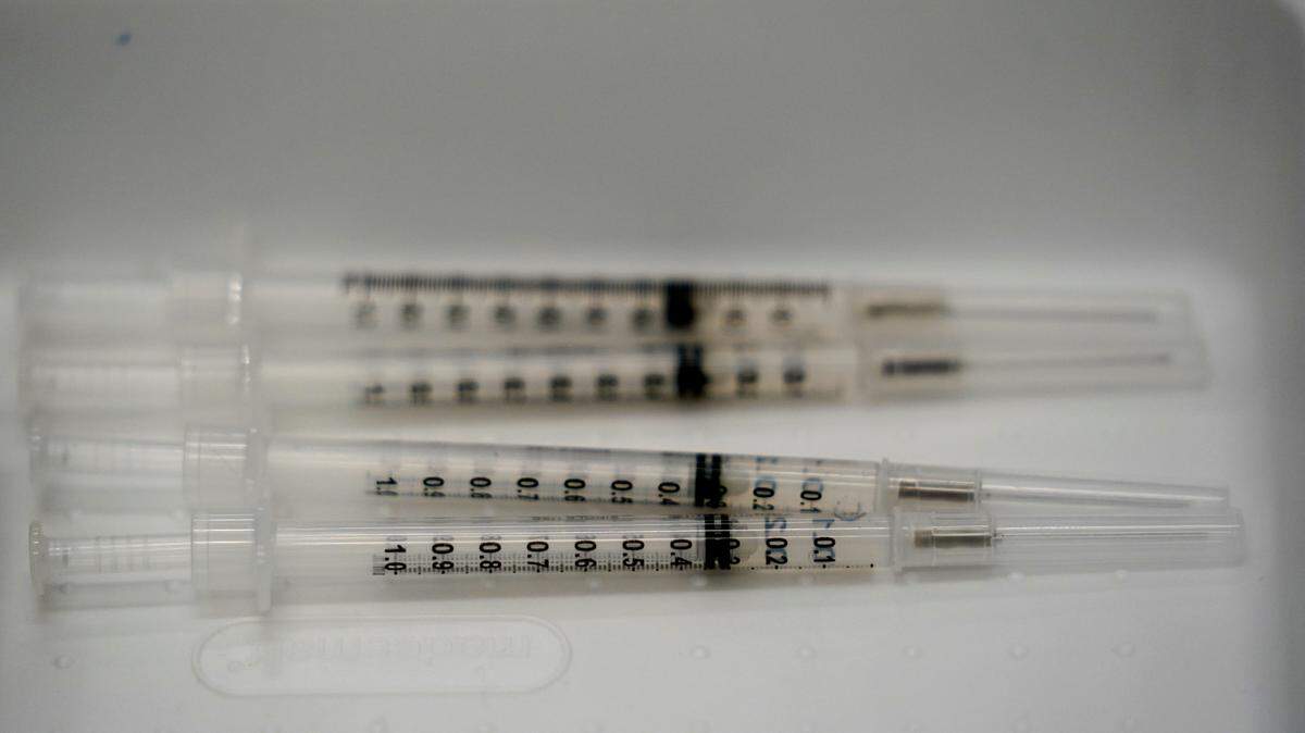 Millions of health care workers are required to be fully vaccinated against COVID-19 by Jan. 4, the White House annonced Nov. 4. (AP Photo/Wilfredo Lee)
