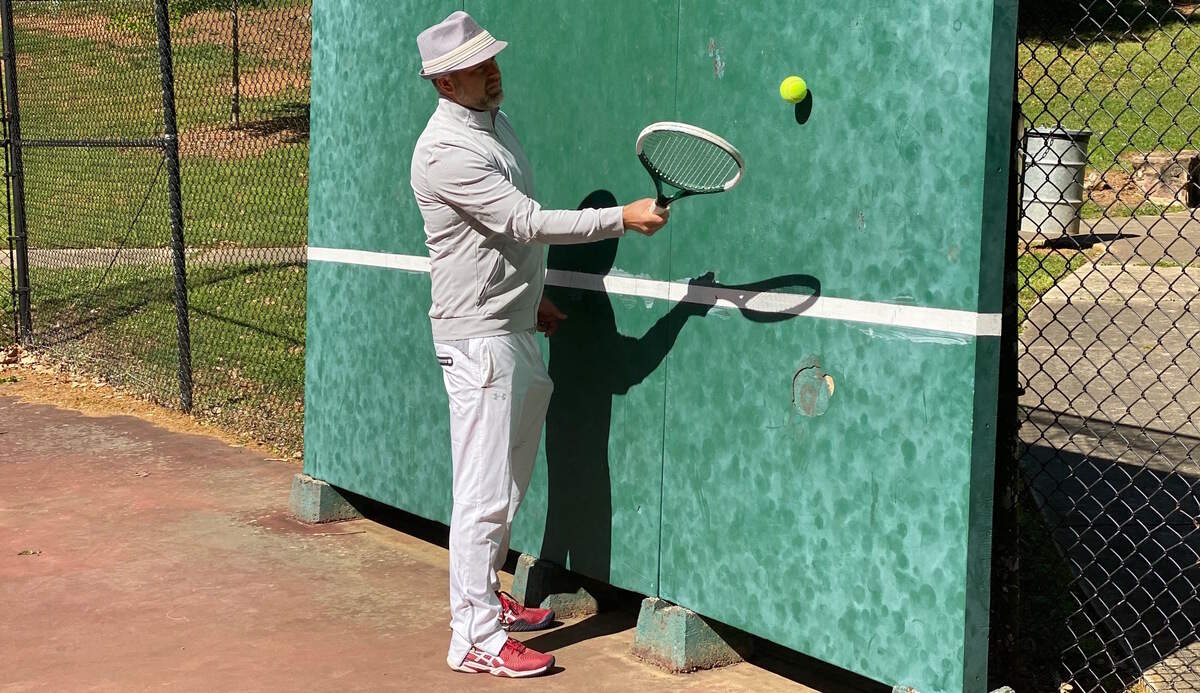 Jeff Tonidandel doing the viral Roger Federer Tennis at home challenge on the wall.