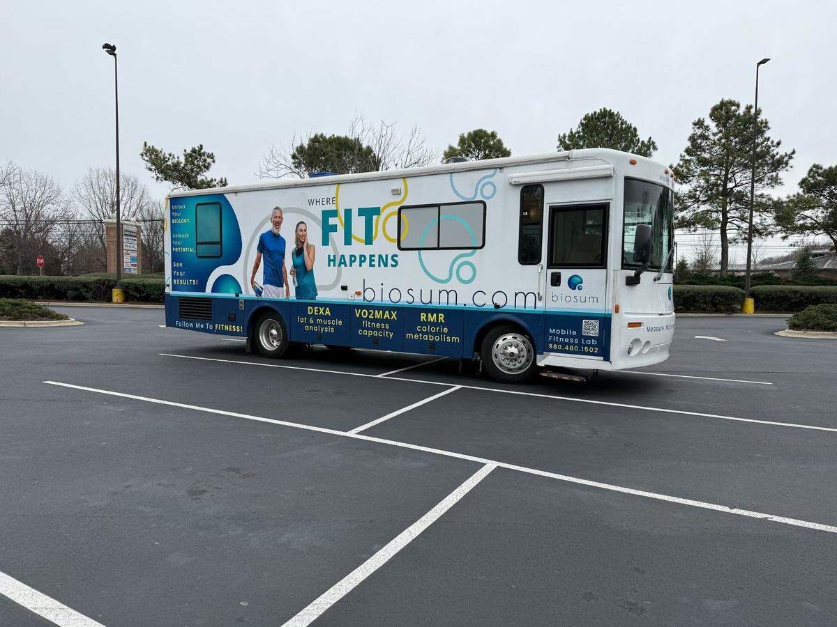 Biosum is housed in a bus, where owners Jacob Kirsch and Lora DiCarlo park it at various locations around Charlotte, where they offer DEXA scans, resting metabolic rate testing and VO2 Max testing.