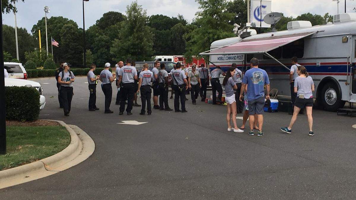 Firefighters gathered at Charlotte Christian School on Sardis Road to search for a missing man who left his south Charlotte home to go on a bike ride.