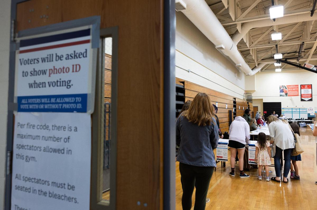 Voters check in to vote at Bradley Middle School in Huntersville, N.C., on Tuesday, November 7, 2023.