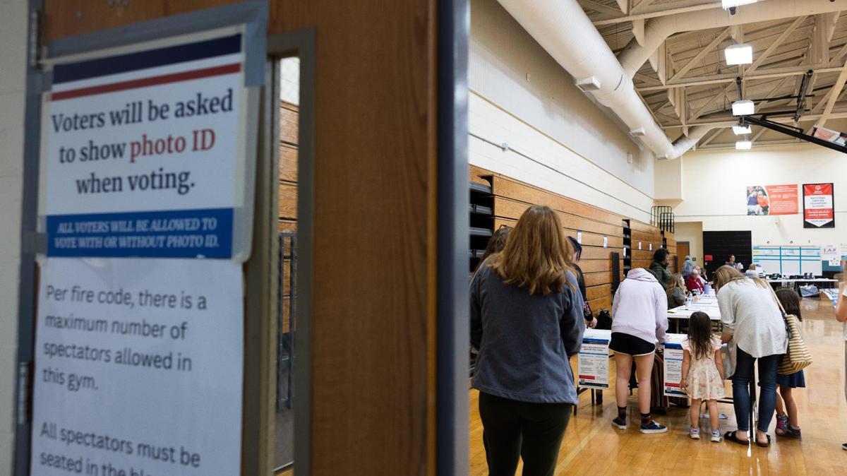 Voters check in to vote at Bradley Middle School in Huntersville, N.C., on Tuesday, November 7, 2023.