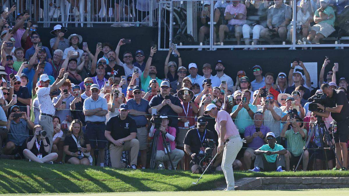 Rory McIlroy chips his ball onto the 18th green en route to a victory at the PGA Tour event in Quail Hollow in 2024. The tournament will switch title sponsors and will be known as the Truist Championship through 2031.