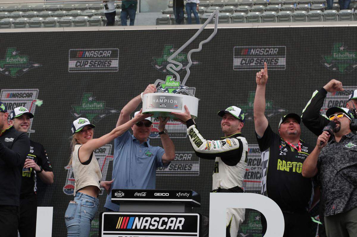 Mar 24, 2024; Austin, Texas, USA; NASCAR Cup Series driver William Byron (24) host the trophy after winning the EchoPark Automotive Grand Prix at Circuit of the Americas.