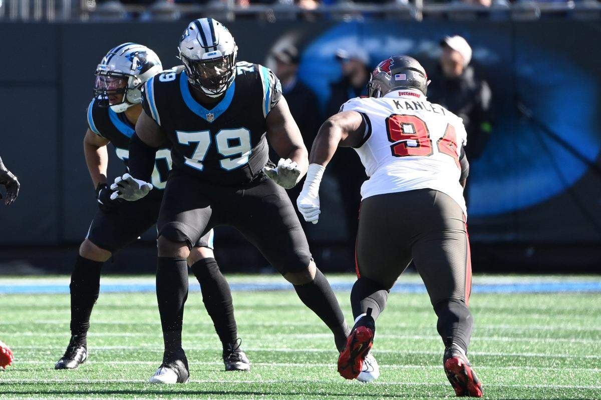 Jan 7, 2024; Charlotte, North Carolina, USA;  Carolina Panthers offensive tackle Ikem Ekwonu (79) blocks as Tampa Bay Buccaneers defensive tackle Calijah Kancey (94) rushes in the first quarter at Bank of America Stadium. Mandatory Credit: Bob Donnan-USA TODAY Sports
