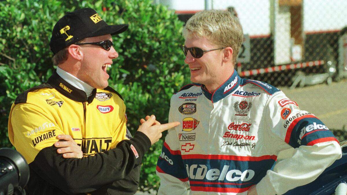 Drivers Matt Kenseth and Dale Earnhardt Jr. joke around with each other in the garage at Daytona International Speedway before the start of NASCAR Busch Series practice on Feb. 8, 1999.
