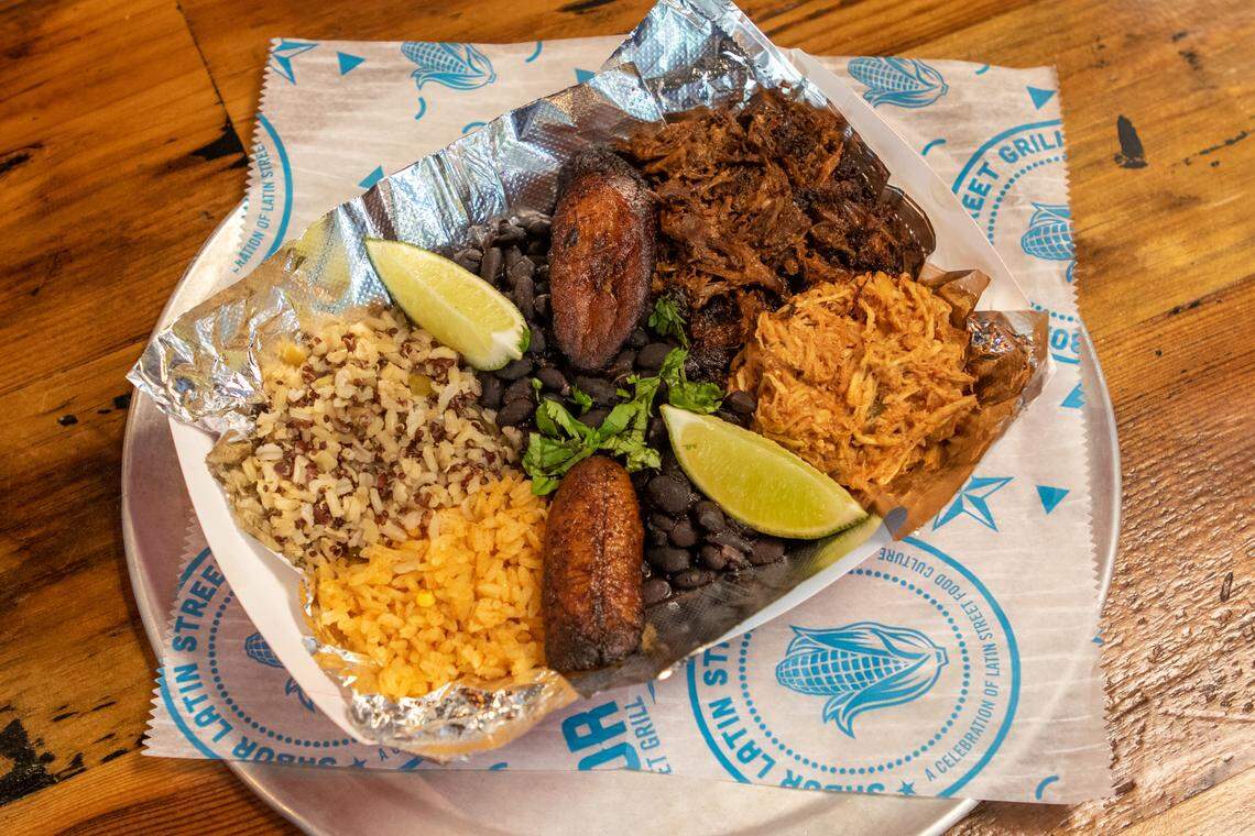 The Cuban Bowl includes beef barbacoa, shredded chicken, black beans, fried plantains and two kinds of rice served with a lime wedge.