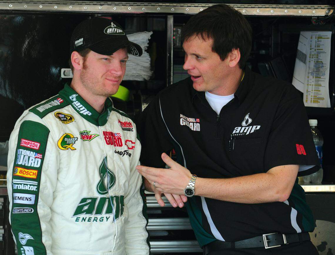 2/18/11 (L-R) NASCAR Sprint Cup Series driver Dale Earnhardt Jr. and crew chief Steve Letarte talk inside the garage Friday at Daytona International Speedway. Jeff Siner - jsiner@charlotteobserver.com