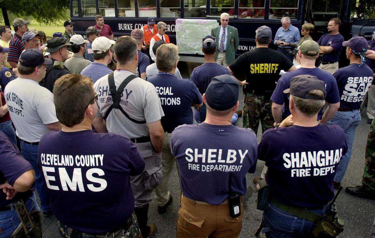 Over 100 people from agencies across North Carolina take part in a search for Asha Degree, 9, on Wednesday afternoon, Aug. 15, 2001, along N.C. 18 in Burke County. Her backpack was found Aug. 3 in Burke County, 26 miles north of where truckers last reported seeing her walking on the highway.