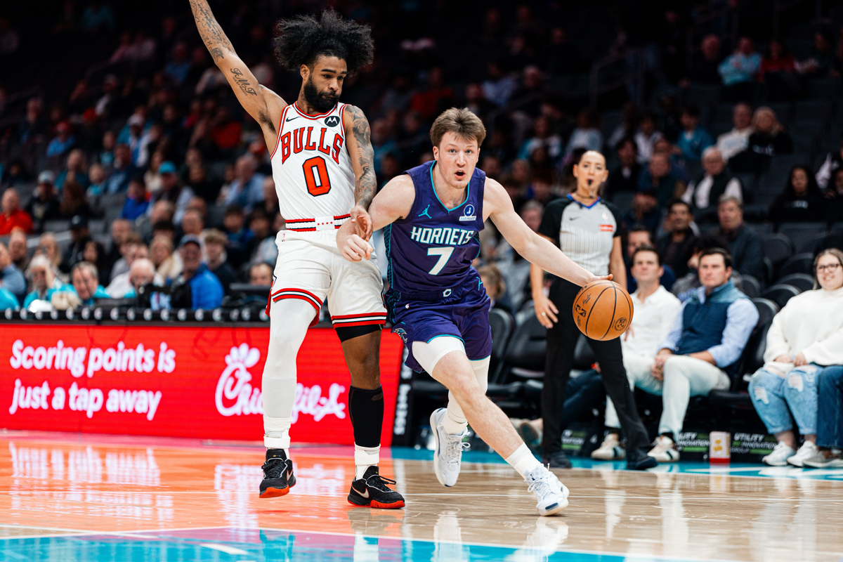 Kon Knueppel drives to the basket against Coby White of the Chicago Bulls.
