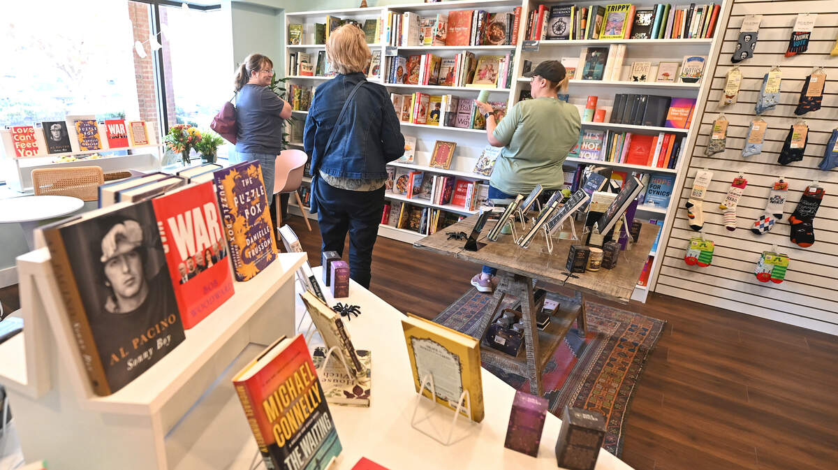 Shoppers mingle in a corner at Troubadour Booksellers on Thursday, October 24, 2024.