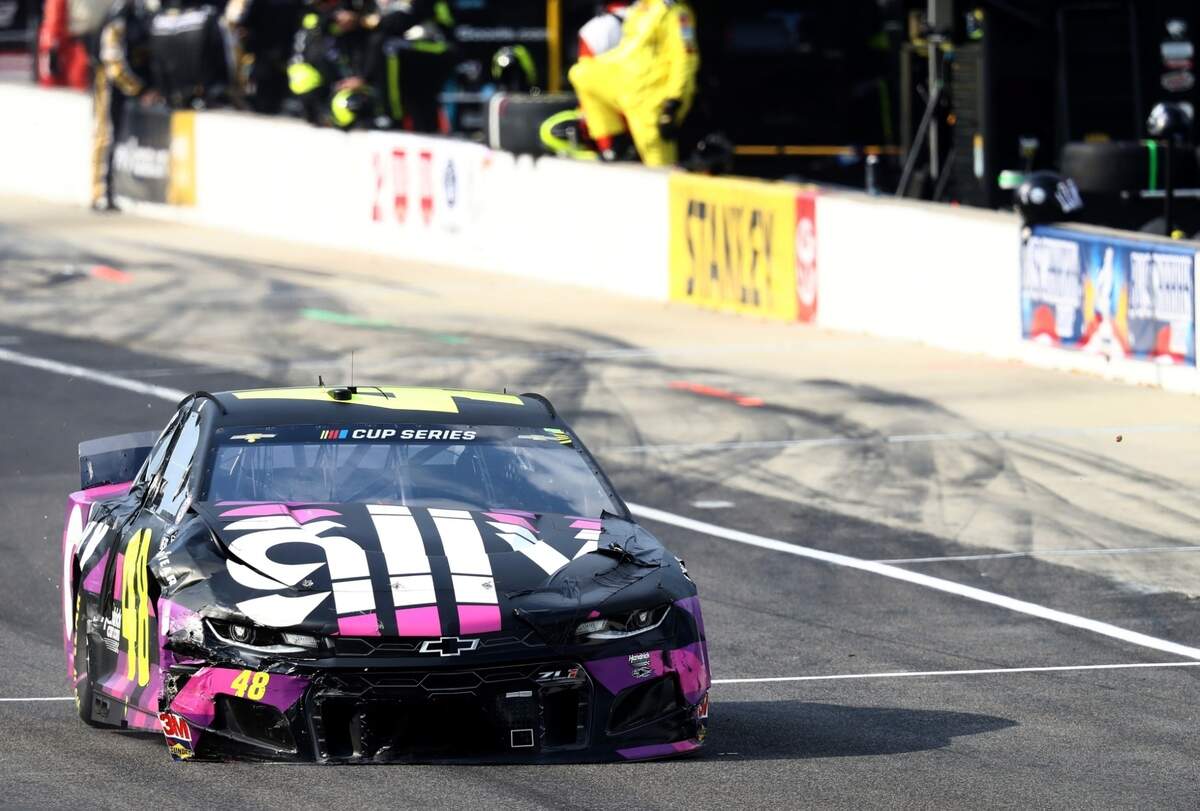 The No. 48 car of Justin Allgaier, leaves pit road banged up after being involved in a 6-car crash at Indianapolis Motor Speedway on Sunday.