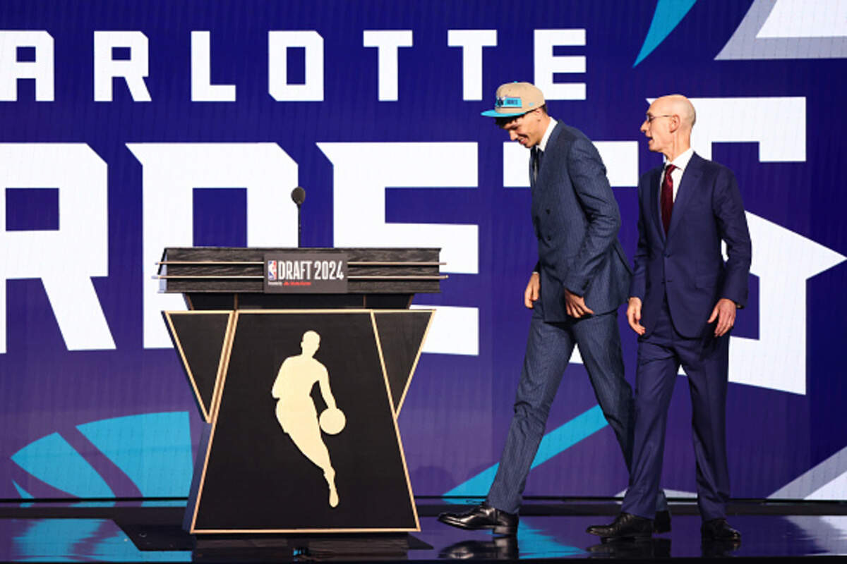 Tidjane Salaün walks the stage after being drafted sixth overall by the Charlotte Hornets during the first round of the 2024 NBA Draft at Barclays Center.